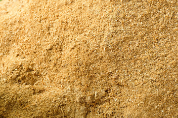 Sawdust stack,Wood Sawdust Texture Background,Wooden sawdust after the production of wood on a sawmill