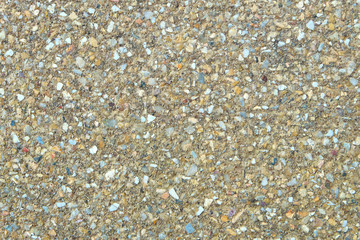 Small sand stone of sand wall texture or sand wall background. Natural brown sand stone for design with copy space for text or image.