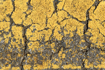 background with cracked yellow line on the old road texture