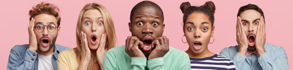 Shocked stupefied dark skinned man and their companions pose against pink background. Emotional...