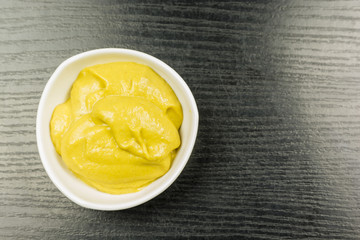 Mustard in a bowl. View from above.