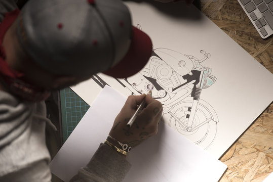Motorbike designer drawing a custom model