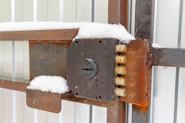 Powerful vintage lever lock on the wicket gate closeup