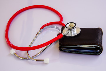 stethoscope on old purse money .Image for finance concept.
