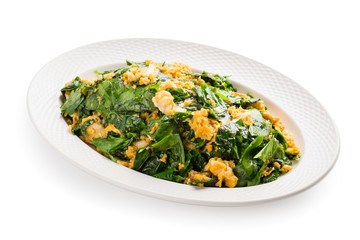 Stir fried Gnetum gnemon or melinjo, Liang vegetable fried with egg delicious local food of Southern Thailand. isolated on white background