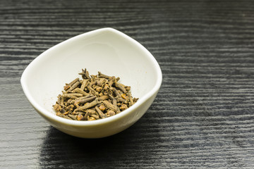 Dried cloves in a bowl.