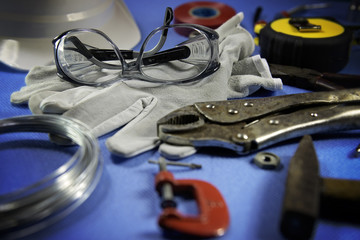 Safety glasses and othe tools on a working table