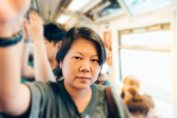 People travel on BTS skytrain train in Bangkok