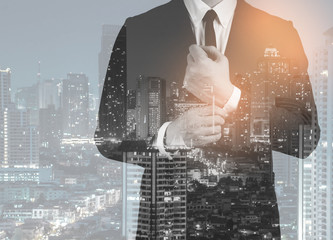 Double exposure of success business man city background.time for business.