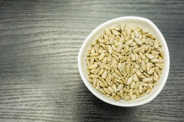 Sunflower seeds dehulled in a bowl. View from above.