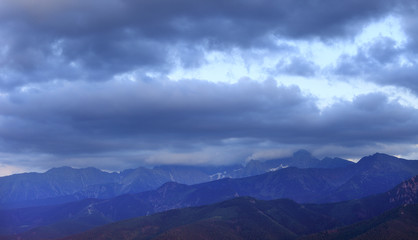 Obraz premium Poland, Tatra Mountains, Zakopane - Kasprowy Wierch, Beskid, Skrajna Turnia, Swinica and Koscielec peaks - High Tatra under clouds