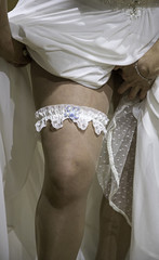 Bride putting on stockings