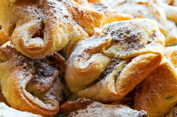 baked rolls with sweet powder and poppy seeds.plan major