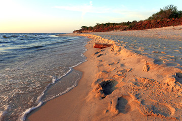Baltic Sea shore line and beach in Rowy, Poland during sunset