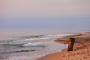 Baltic Sea shore line and beach in Rowy, Poland during sunset