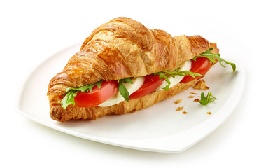 croissant sandwich with tomato and mozzarella