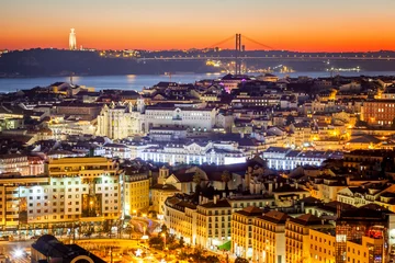 Fotobehang beautiful cityscape, Lisbon, the capital of Portugal at sunset. A popular destination for traveling through Europe, one of the most beautiful cities in the world © olezzo