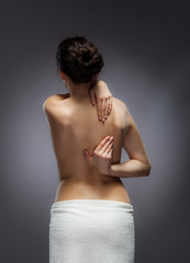 Woman massaging pain back