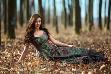 Beautiful woman in green dress outdoor