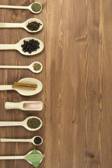 spices in a row on kitchen table