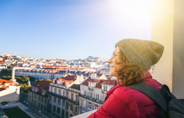 Fototapeta premium beautiful young student student tourist in Lisbon, view of the city, Portugal - a popular destination for traveling in Europe