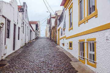Beautiful cityscape. Cobbled street in the center of Nova Costa, Portugal