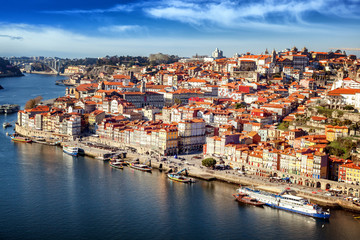 Fototapeta na wymiar Beautiful cityscape, Porto, Portugal, old city. View of the city and the river. A popular destination for traveling in Europe