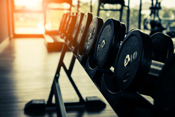 Plakat Rows of dumbbells in the gym with hign contrast and monochrome color tone