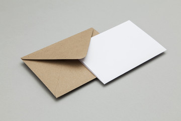 Blank white card with kraft brown paper envelope template mock up