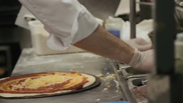 Chef preparing a Pizza