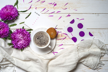 Word relax with cup of coffee and pink flowers