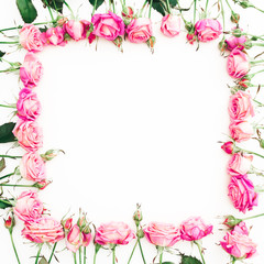 Fototapeta na wymiar Floral frame of pink roses and buds on white background. Flat lay, Top view.