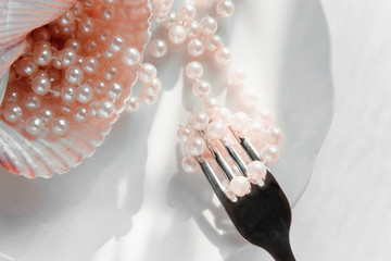 The abundance of life - precious necklace of pink pearls in the dish of destiny. Luxury lifestyle -...