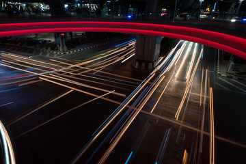 Long exposure light trails in cross road bridge