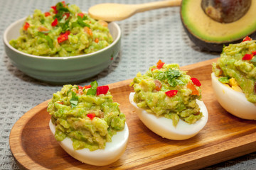 eggs stuffed with guacamole with coriander and chili