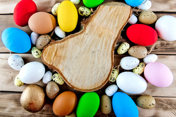 Colored easter eggs background with copy space.