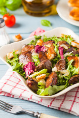Warm salad with grilled chicken liver and toast