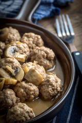 Delicious homemade swedish meatballs with mushroom cream sauce. Small depth of field.