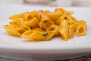 Italian pasta dish with salmon and prawns