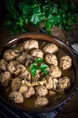 Delicious homemade swedish meatballs with mushroom cream sauce. Small depth of field.