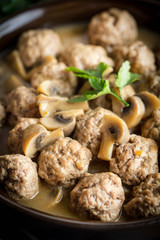 Delicious homemade swedish meatballs with mushroom cream sauce. Small depth of field.