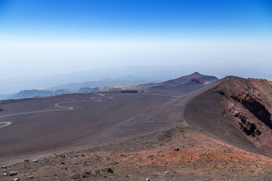 The volcano of Etna, Sicily, Italy. Side craters and road - serpentine, leading to the top