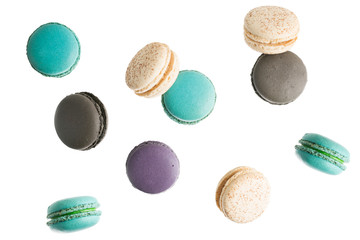flying Colorful macarons on white background. Minimal pattern, creative dessert concept
