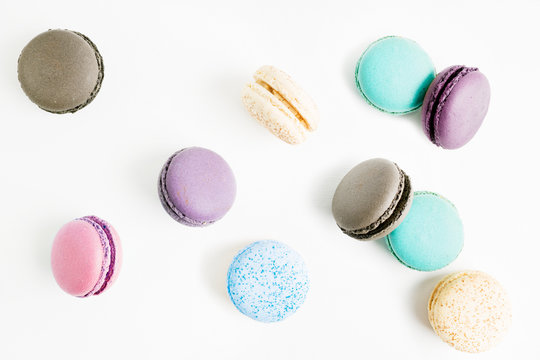 flying Colorful macarons on white background. Minimal pattern, creative dessert concept