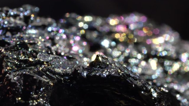 BOKEH: Mineral form of iron oxide with a glass like metallic surface sparkles intensely under light. Radiant Haematite glimmering in variety of colors. Dark Hematite used in semi precious jewelry.