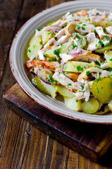 Potato salad with chicken and pickled cucumbers