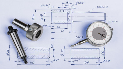 Metal engineering components, gauge and technical drawing. Steel machining jigs and dial gauge...