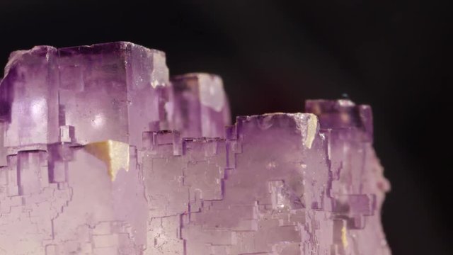 Macro closeup transparent cube formation of violet semi precious amethyst