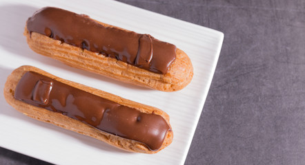 Homemade eclair on a stone table