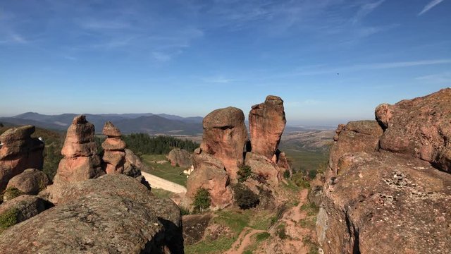 Slow pan on sandstone and conglomerate formations in Western Bulgaria footage - Colorful group of rocks near town of Belogradchik